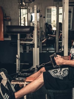 Man in Black Tank Top Exercising